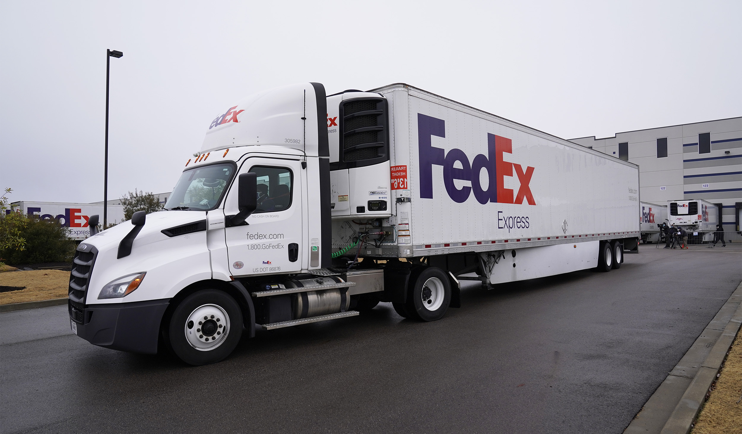 FedEx trucks move the Moderna vaccine from the McKesson distribution center in Mississippi. (Photo by Paul Sancya - Pool/Getty Images)