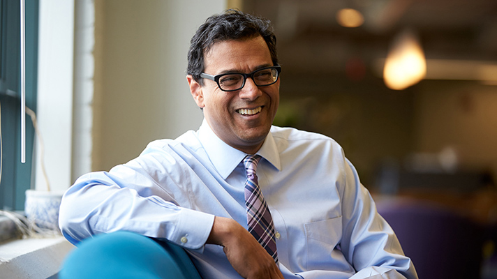 Atul Gawande sitting on couch