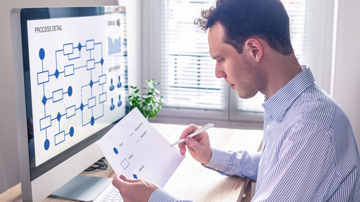 Man looking at process automation software.