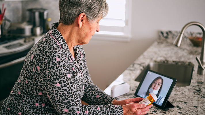 Senior attending telehealth appointment