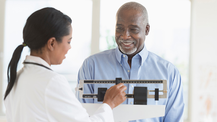 Minority patient getting a checkup.