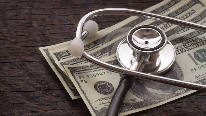 Money and stethoscope 