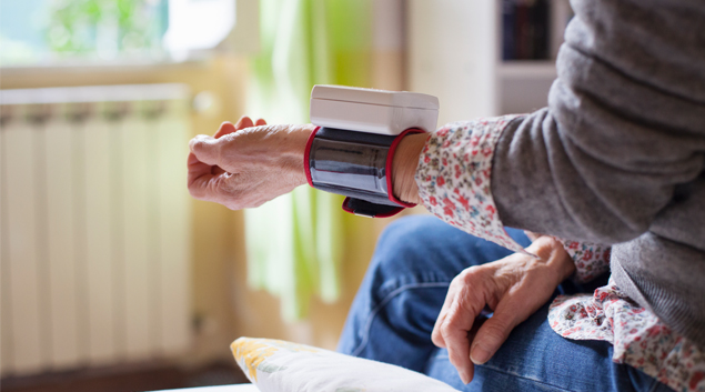 An arm with a wrist monitor