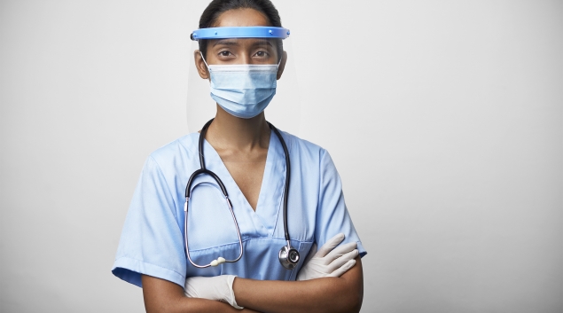 Person wearing stethoscope wearing mask