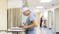 Doctor at desk in hallway