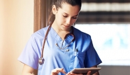 Medical worker using a tablet. Photo: PeopleImages/Getty Images