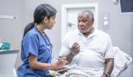 Patient conferring with doctor