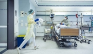 Hospital room with patient and caregiver