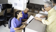 Patient asks receptionist for his medical records.