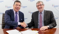 From left: John M. Murphy, MD, president and CEO of Nuvance Health, shakes hands with Northwell President and CEO Michael Dowling, at a signing ceremony. 