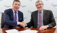 From left, John M. Murphy, MD, president and CEO of Nuvance Health, shakes hands with Northwell president and CEO Michael Dowling at a signing ceremony.