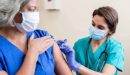 Healthcare professional administering vaccine