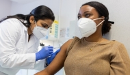 Healthcare worker giving vaccine to patient