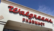 A Walgreens pharmacy sign over entrance