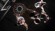 Basketball players driving to the basket on an unknown court