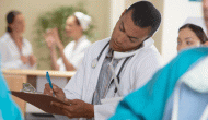 doctor on the phone using a clipboard