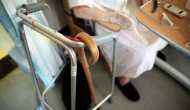 elderly person in hospital with cane