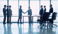 Two business groups meeting (Photo by Martin Barraud/Getty Images)