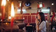 Person praying in religious setting