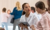 Healthcare worker with tablet talking to patient